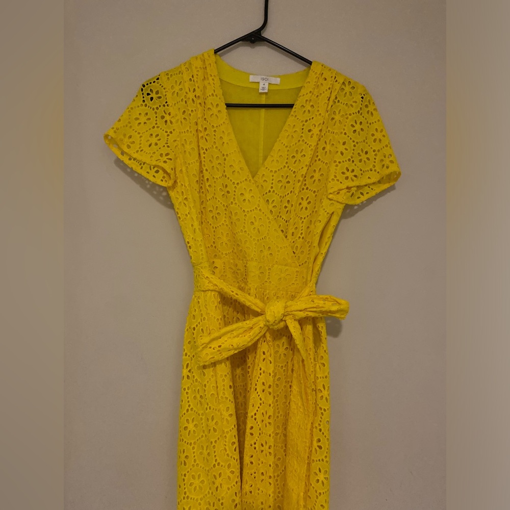 Bright yellow spring cotton dress with bow.